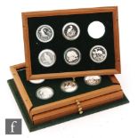 Royal Mint - A set of twenty four silver proof coins for the World Wild Life Fund contained in four