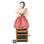 An Armand Marseille bisque head doll automaton of a girl in Italian dress playing a mandolin with