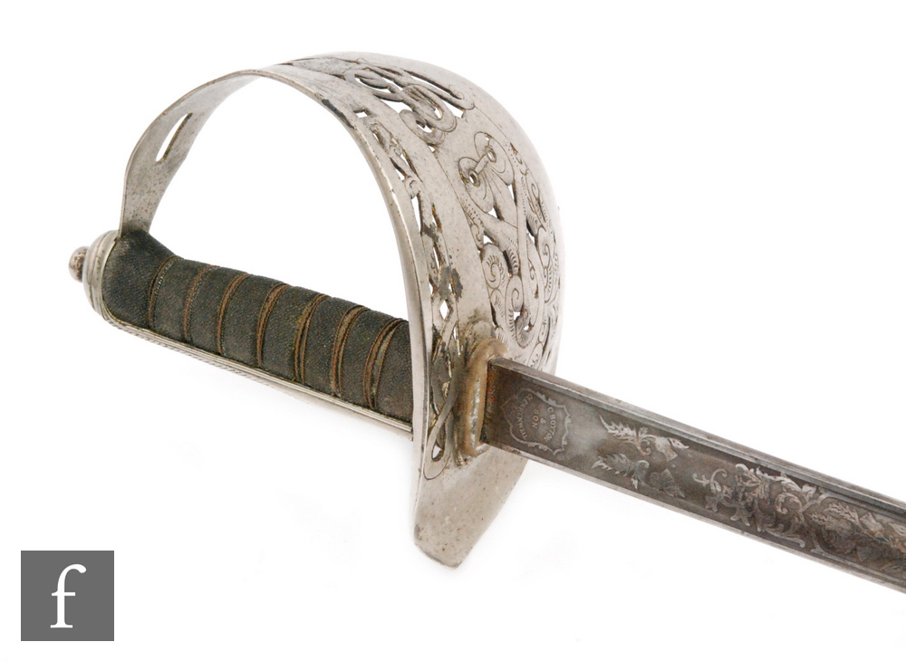 An early 20th Century Artillery officers sword and leather scabbard,