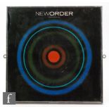 A collection of four framed New Order album covers,