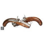 A pair of 19th Century Irish percussion pistols,