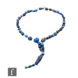 Roman 2nd to 4th Century AD - A string of lapis lazuli blue coloured beads with a spiral lentoid