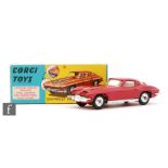 A Corgi Toys #310 Chevrolet Corvette Stingray diecast model in metallic cerise with yellow interior
