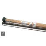 A Sage Graphite III 10150-3 double handed fly rod, 3 piece, 15' in Sage metal rod tube.