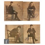 Four Beatles signatures, each of the four black and white newspaper cuttings depicting John, Paul,