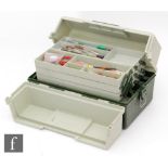 A Shakespeare Snowbee cantilever tackle box containing a large quantity of Devon minnows,
