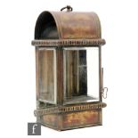 A 19th Century brass marine lantern of wedge form with bevelled glass side panels,