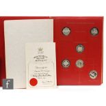 An album of forty three silver coins to commemorate The Kings and Queens of England,