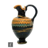 Roman 2nd to 4th Century AD - A miniature dark black glass jug with multi yellow zig zag bands of