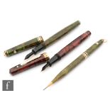 A Whal Eversharp fountain pen with 14ct gold nib and green marble effect pen with a matching