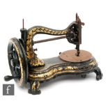 A 19th Century cast iron sewing machine with floral gilt leaf decoration on scroll base, No 4791,