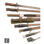 A World War One German bayonet and scabbard stamped P Weyersberg, two 1907 pattern bayonets,