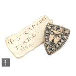 A Medieval bronze heraldic seal for S' RADVLFI TIREL depicting a key of fleur de lys,