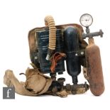 A World War Two scuba diving apparatus to include oxygen tank and canvas fittings and a separate