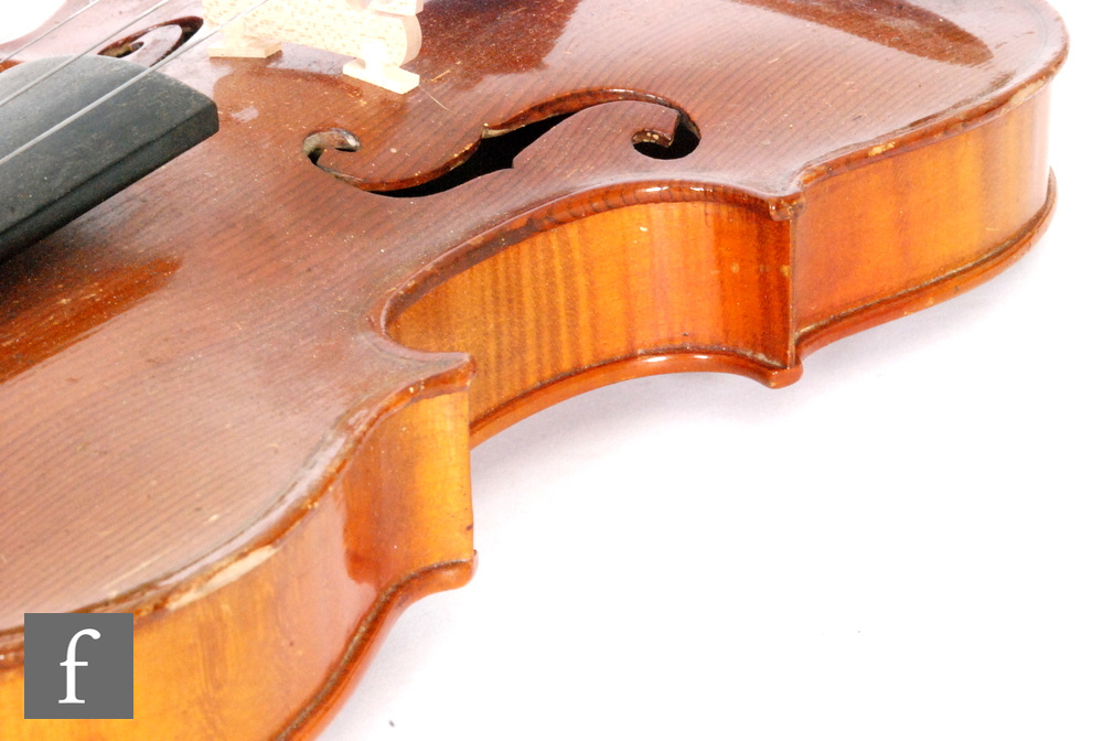 A 1920 to 1930s violin, the reverse stamped Stainer, length of back 35.5cm and with a bow, cased. - Image 13 of 17