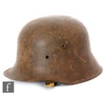 A World War One German helmet with side lugs and later lining