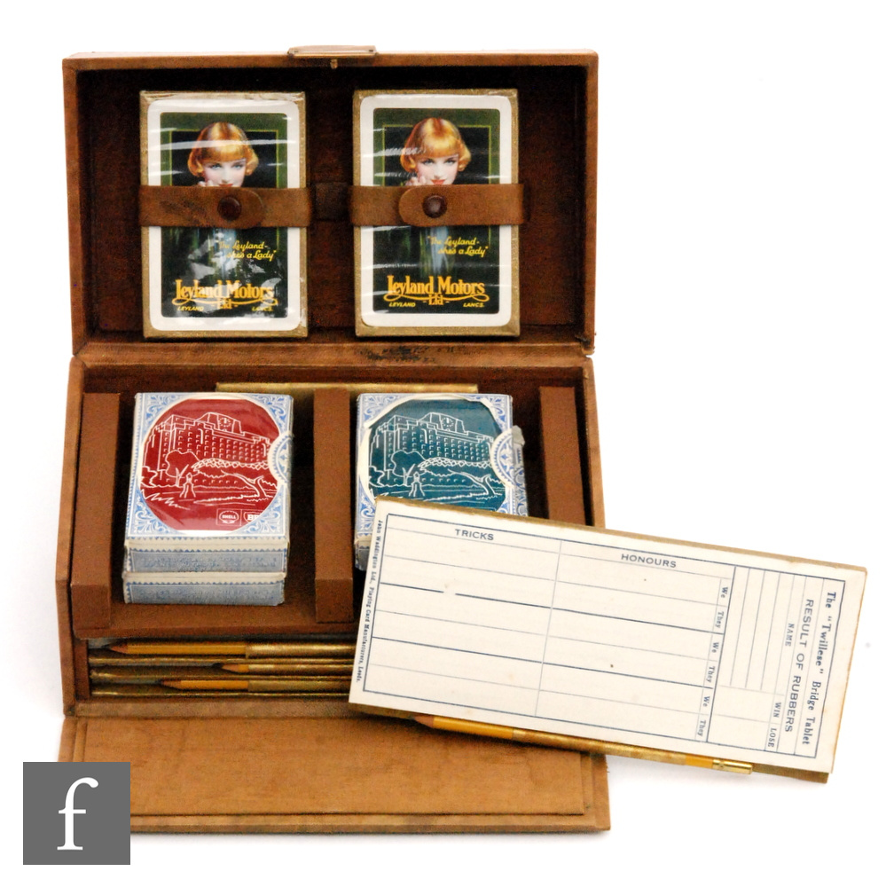 A 1930s leather cased bridge set fitted with two packs of Leyland Motors pictorial cards and four