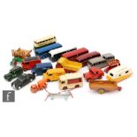 A collection of playworn Dinky Toys diecast models, mostly buses and commercial vehicles,