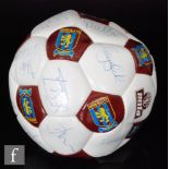 An Aston Villa football signed by previous stars including Steve Staunton, Dean Saunders,