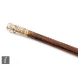 An early 20th Century Boy Scout cane with plated fleur de lys top 'Be prepared', length 77cm.