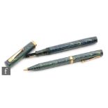 A Watermans fountain pen, 14ct gold 4 nib and 9ct gold band,