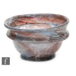 Roman 2nd to 4th Century AD - A purple and pale blue marbled effect cup with finger rim to body,