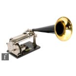 A Columbia Graphophone phonograph with key wind operation, fixed horn and original reproducer,