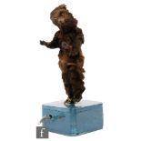 A 19th Century clockwork automaton of a brown dancing bear on later blue painted base,