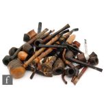 A collection of 19th Century and later pipes, mainly wooden, to include pipes of plain form,