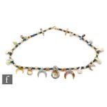 Roman 2nd to 4th Century AD - A string of iridescent and lunar drop beads with interspaced blue