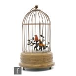 A post 1950s Griesbaum singing bird-in-a-cage,