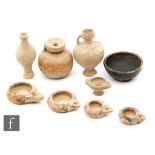 A collection of ancient Albanian Sier ware to include four painted terracotta lamps, two small jugs,
