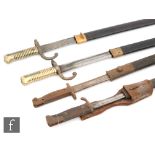 A pair of 19th Century French bayonets and scabbards and two World War One bayonets and scabbards
