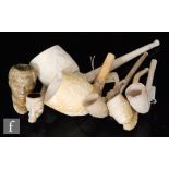 A collection of 19th Century and later clay pipes, including a figural General Gordon,