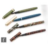 A Watermans Ideal fountain pen grey and brown marbled effect pen, another in umber,