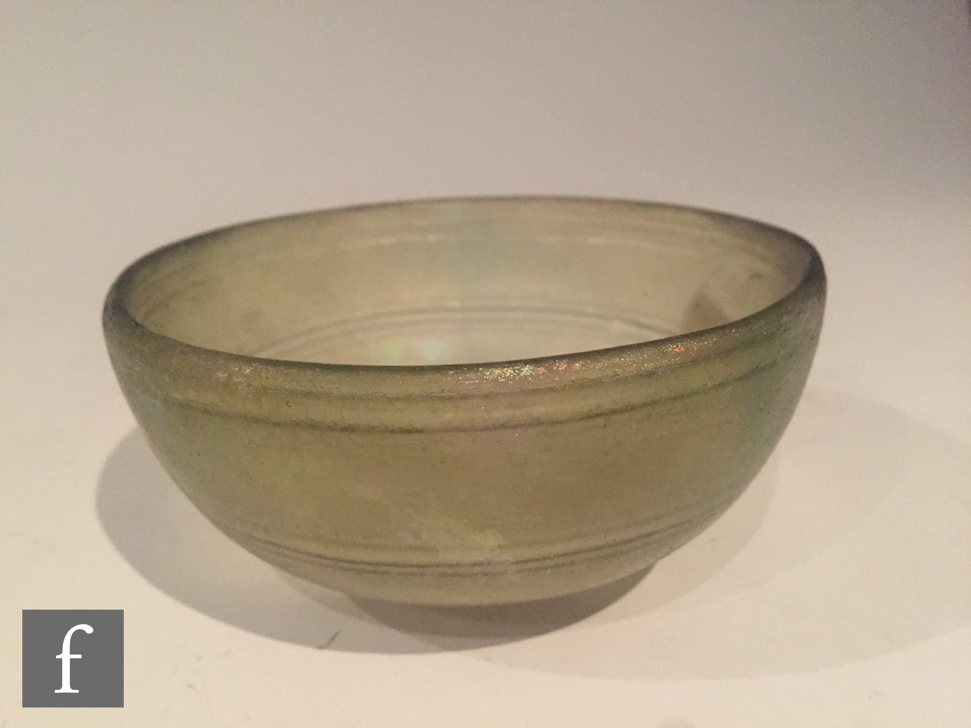 Roman 2nd to 4th Century AD - A pale green glass shallow bowl with traces of iridescence and - Image 3 of 5