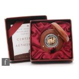 Elizabeth II - An 1899-1999 Perth mint centenary sovereign in teak case with certificate and