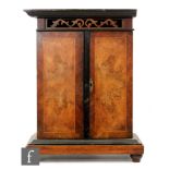 A musical wall mounted cabinet with coin the slot operating, later fitted shelf,
