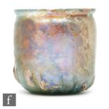 Roman 2nd to 3rd Century AD - An iridescent green glass beaker with flared rim and slashed ribs to