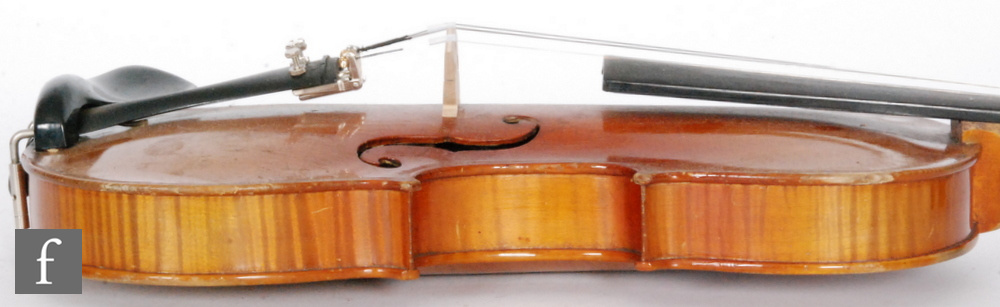 A 1920 to 1930s violin, the reverse stamped Stainer, length of back 35.5cm and with a bow, cased. - Image 4 of 17