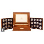 Elizabeth II - Twenty four silver proof coins for the Golden Jubilee collection in teak case with