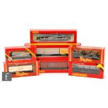 A collection of OO gauge Hornby rolling stock including steel carrier, crane truck, assorted wagons,
