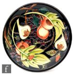 A Moorcroft Pottery plate in the Queen's Choice pattern, impressed and painted marks, diameter 25cm,