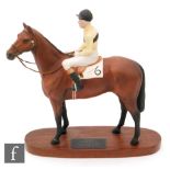 A Beswick Connoisseur model of Arkle with Pat Taaffe up, mounted to an oval wooden plinth, height