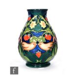 A Moorcroft Pottery vase in the Strawberry Thief pattern, of footed ovoid form with collar neck,