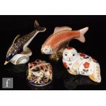 A collection of four Royal Crown Derby paperweights comprising a frog, a seal (gold stopper), a