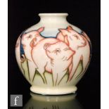 A Moorcroft Pottery vase in the Fowler's Farmyard Pigs pattern designed by Kerry Goodwin, the footed