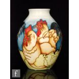 A Moorcroft Pottery vase in the Fowler's Farmyard Chicken pattern, of ovoid form with collar neck,