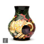 A Moorcroft Pottery vase in the Figgy Pudding pattern designed by Emma Bossons for Christmas 2015,