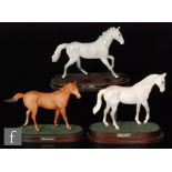 A collection of three Royal Doulton horse figures, Desert Orchid, Lammtarra and One Man, all mounted